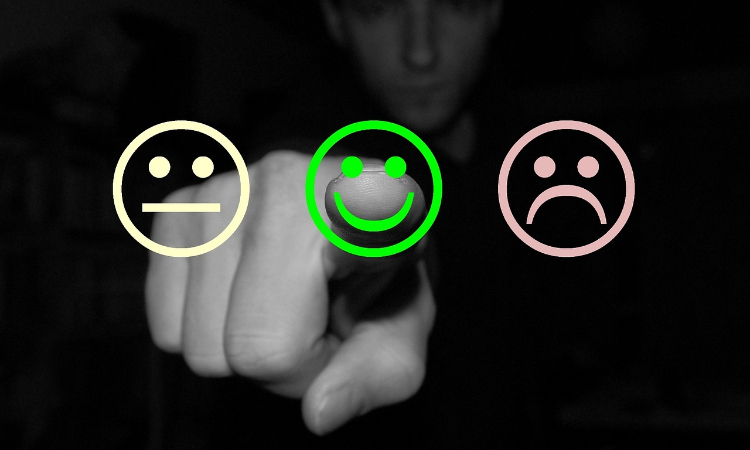 Customer support misconception photo of 3x emojis: 1 happy face, 1 upset face, and 1 neutral face